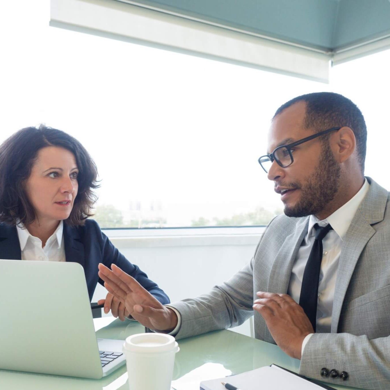 Business partners having a regular meeting to discuss division of labor